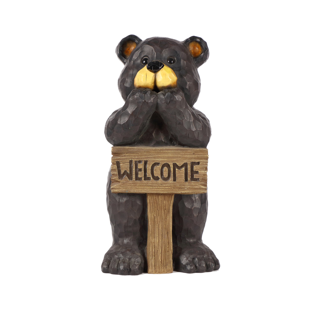 BEAR LEANS ON WELCOME SIGN